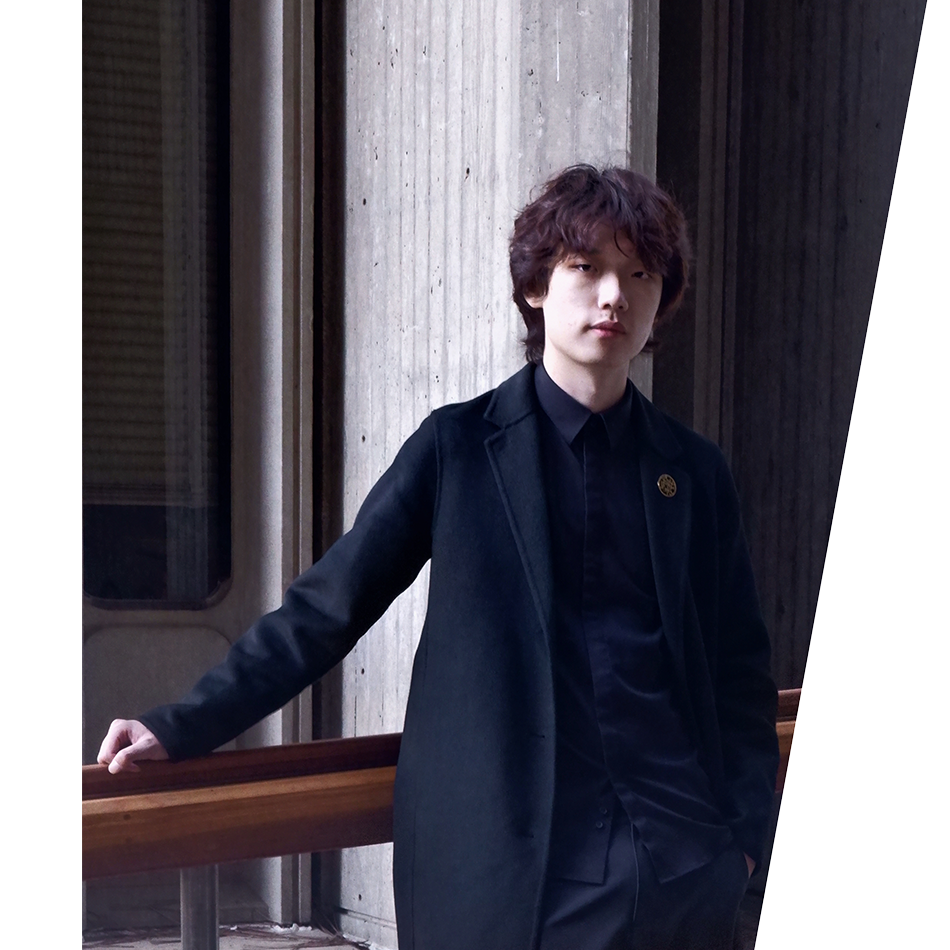 Profile Picture of Adrián Moreno (@zetxek), working side by side with a colleague: sitting on a desk, while looking at a screen